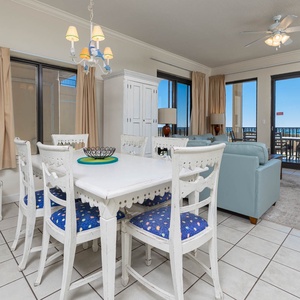 Dine at the charming table while enjoying the inviting atmosphere and views from the large sliding glass doors