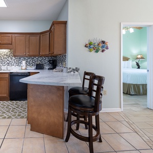 Enjoy this kitchen with the family, surrounded by stylish decor and vibrant coastal accents