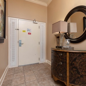 Step into a welcoming entryway adorned with charming decor, inviting you to start your beach getaway