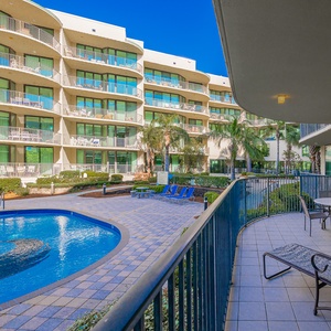 Breathe in the coastal atmosphere as you lounge on the balcony, enjoying views of the inviting pool below