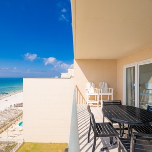 Breathe in coastal air while you relax at the table on your balcony overlooking the shore and sky