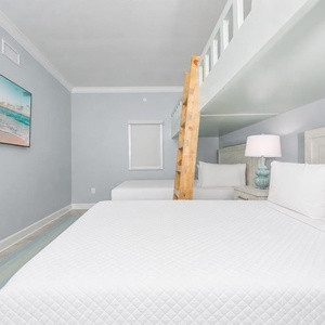 Stream your favorite shows after a beach day to unwind with the family in this cheerful bunk room