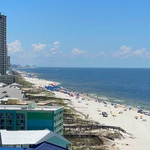 Survey the sweeping gulf view as waves ripple toward the shore and visitors stroll below