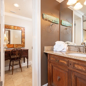 Experience relaxation at the stylish vanity area in the master suite with a relaxing jetted tub with a beachfront view