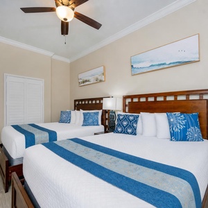 Two queen beds in the guest suite invite you to unwind after a day filled with coastal adventures