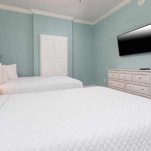 Sink into plush queen bedding as you relax and enjoy your favorite shows in this guest retreat