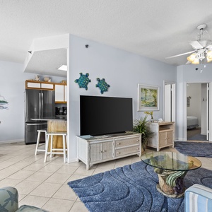 Gather around the cozy living area to enjoy family movie nights, surrounded by vibrant coastal decor