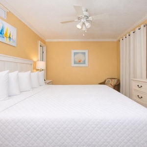 Retreat to the king guest suite, enjoying the soothing vibe from the coastal-inspired decor and restful space