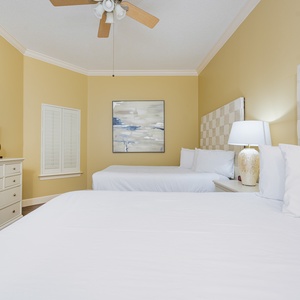 Cozy up in the inviting queen beds, where soft linens promise restful nights after fun-filled days by the beach
