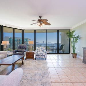 Unwind in the comfortable living area with plush seating while soaking in delightful bay views