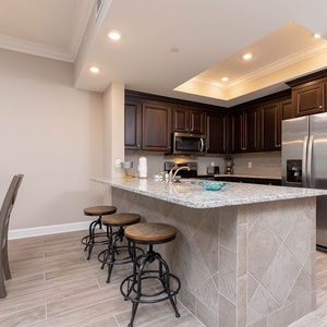 Gather around the inviting breakfast bar, sharing laughter and stories while enjoying coastal comforts