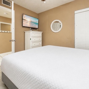 Unwind after a day at the beach in this queen guest suite with a soothing vibe created by soft lighting and coastal decor