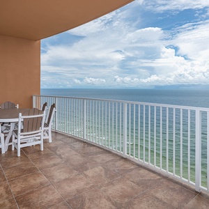 Savor your morning coffee at this balcony table while listening to the gentle sounds of the coast