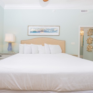Brightly colored walls complement the king bed in the master suite, creating a serene and inviting atmosphere