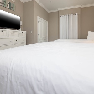 Unwind in this queen guest suite and stream your favorite shows or enjoy a good movie after a beach day