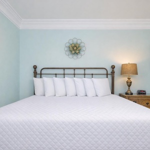 Immerse yourself in relaxation on this soft king bed in the guest room, where restful nights await after a day of beachside fun