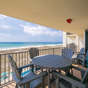 Savor the coastal vibe on your balcony while soaking in breathtaking views of the beach and gentle waves