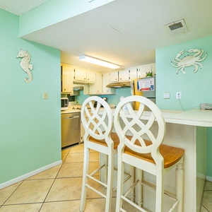 Gather around the bar stools to share laughter while planning your next adventure along the coast