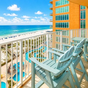 Lean back on high chairs along the railing, feel a shore breeze and watch umbrellas and pools below