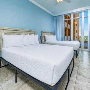 Enjoy coastal views from the windows in this queen guest suite, perfect for relaxing after a day at the beach