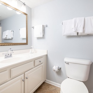 Freshen up in this guest bath in the relaxing shower or soothing tub before an exciting beach day