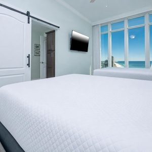 Unwind in this queen guest suite and stream your favorite shows or enjoy a good movie after a beach day