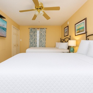 Savor movie nights as you relax in this queen guest suite, with calming decor enhancing your cozy beach retreat