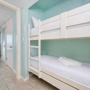 Bunk beds in the hallway offer a cozy spot for the kids after fun-filled days along the coast