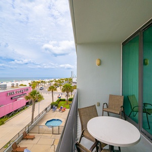 Gaze at the shimmering water and expansive shoreline, perfect for relaxation and beach walks under a clear blue sky