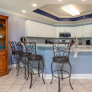 Gather around the stylish bar seating in the kitchen, perfect for casual meals and conversations