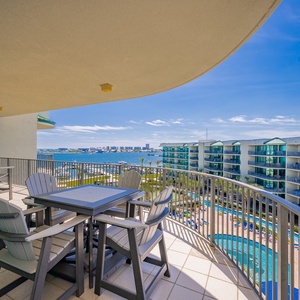 Breathe in the fresh air while unwinding on the balcony, taking in the tranquil view of the shimmering bay