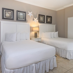 Experience restful nights in this queen guest bedroom, where plush bedding invites you to recharge
