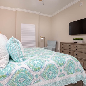 Relax on the cozy king bed in this guest suite and stream your favorite shows after a beach day