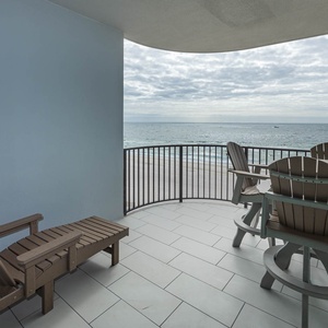 Relax on the spacious balcony with comfortable seating, perfect for enjoying the tranquil views and fresh air