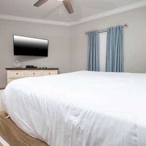 Relax on the cozy queen bed in this guest suite and stream your favorite shows after a fun vacation day