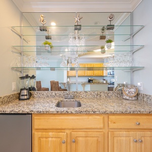 Craft refreshing drinks at the wet bar, surrounded by thoughtful decor and a cozy vibe for family gatherings