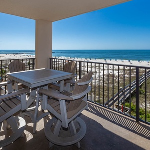 Savor meals or drinks on the balcony, with expansive views of the beach and calming waters
