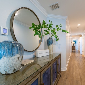 Step into a welcoming hallway adorned with tasteful decor, setting the perfect tone for your coastal getaway