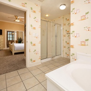Refresh in the master bath after a day at the beach with a soothing jetted tub and relaxing walk-in shower