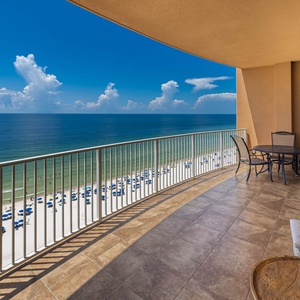 Enjoy meals or drinks on the balcony while taking in sweeping views of the tranquil shoreline and beach below