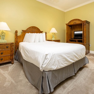 Rest peacefully in this cozy queen suite, enjoying soft bedding and a quiet retreat, perfect for rejuvenation