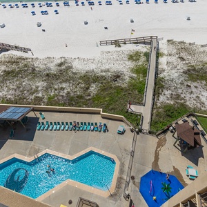 Enjoy the vibrant pool area and beach access just steps away, perfect for relaxation and fun in the sun