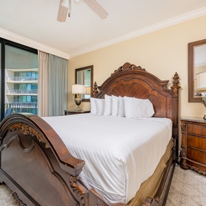 Retreat to this elegant king master suite with cozy bedding and drift off to coastal sights and sounds of the bay
