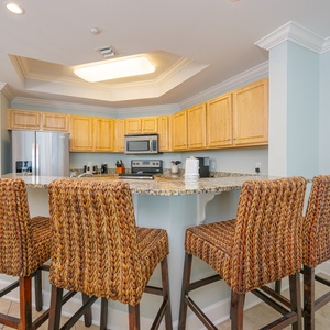 Gather around the inviting breakfast bar, perfect for sharing laughter and plans while enjoying coastal vibes