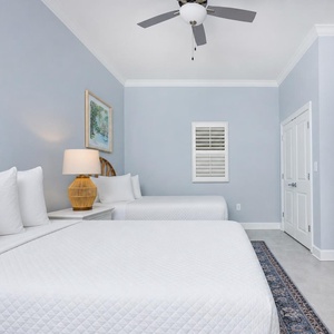Relax in this queen room featuring two comfortable beds and a large TV for streaming your favorite show