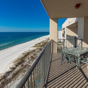 Dine al fresco at the outdoor patio table while enjoying breathtaking views of the coastline and tranquil waters