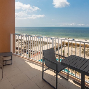 Unwind on a balcony chair, feel the gulf breeze, and watch the beach glisten in the sun