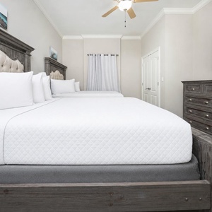 Relax on one of the cozy queen beds in this guest suite and enjoy a peaceful slumber