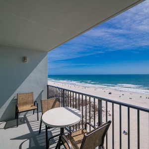 Relax on your balcony with a gentle breeze and the rhythmic sound of waves meeting the shore