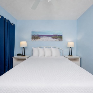 Cool blue walls calm your senses as you rest easily on the queen bed in the guest suite